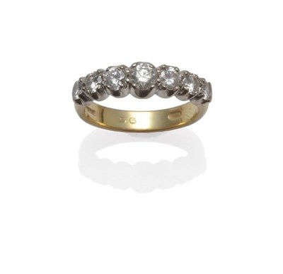 Lot 1026 - An 18 Carat Gold Diamond Seven Stone Ring, the graduated round brilliant cut diamonds in white claw