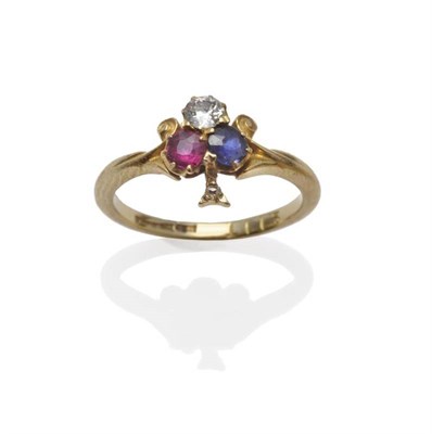 Lot 1028 - A Ruby, Diamond and Sapphire Trefoil Ring, the old cut diamond, a ruby and a sapphire in yellow...