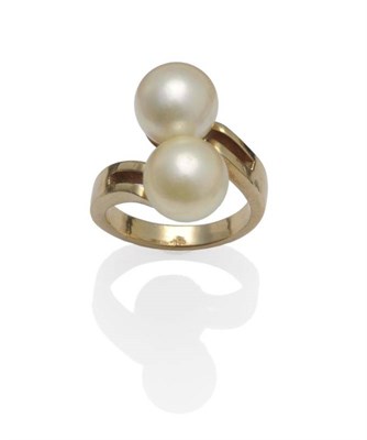 Lot 1035 - A Cultured Pearl Twist Ring, the two golden coloured pearls on yellow twist shoulders with a...