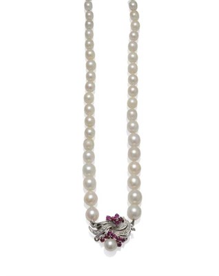 Lot 1040 - A Cultured Pearl Necklace, sixty-eight graduated pearls knotted to a diamond and ruby spray...