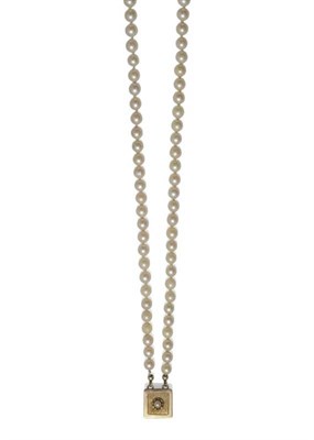 Lot 1041 - A Cultured Pearl Necklace, two rows of graduated cultured pearls knotted to a yellow square...