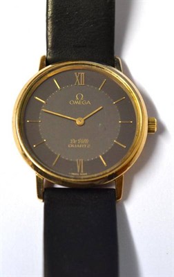 Lot 1050 - A 9ct Gold Wristwatch, signed Omega, model: DeVille, circa 1985, quartz movement, dark grey...