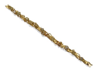 Lot 1064 - A Contemporary Gem Set Bracelet, the yellow triangular shaped links in polished and textured finish