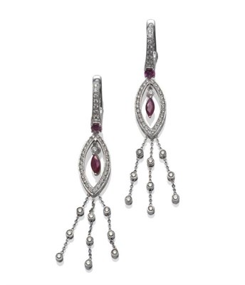 Lot 1074 - A Pair of 18 Carat White Gold Ruby and Diamond Drop Earrings, a diamond set bar to a round cut ruby