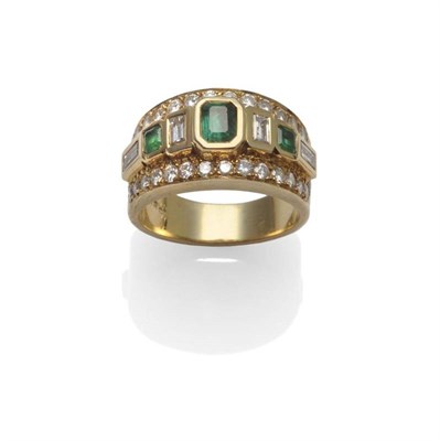 Lot 1085 - An Emerald and Diamond Ring, three emerald-cut emeralds alternate with four baguette cut...