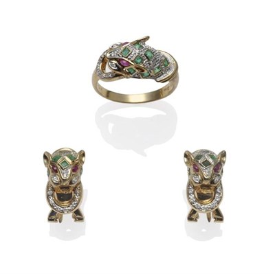 Lot 1091 - A 14 Carat Gold Gem Set Leopard Ring, the leopard head set with square step cut emeralds,...