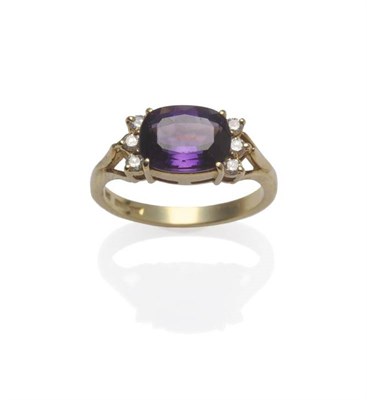 Lot 1099 - An 18 Carat Gold Amethyst and Diamond Ring, the cushion shaped mixed cut amethyst with three...