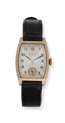 Lot 1101 - A 9ct Gold Tonneau Shaped Wristwatch, signed Rolco, 1935, lever movement, silvered dial with Arabic