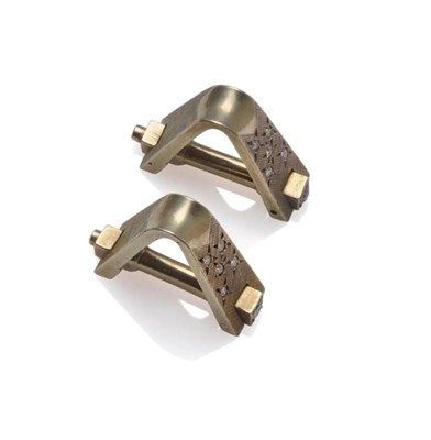 Lot 1103 - A Pair of 9 Carat Gold Cufflinks, of triangular form, the textured finish inset with round...