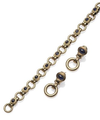 Lot 1117 - A 9 Carat Gold Sapphire Set Bracelet, double bar links alternate with loop links, the bars each...