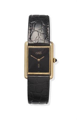 Lot 1120 - A Silver Gilt Rectangular Wristwatch, signed Cartier, model: Must de Cartier, circa 1980, lever...