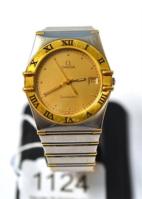 Lot 1124 - A Bi-Metal Calendar Centre Seconds Wristwatch, signed Omega, model: Constellation, circa 1990,...