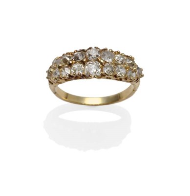 Lot 1132 - A Diamond Two Row Ring, the old cut diamonds in yellow claw settings, to tulip style shoulders on a