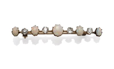 Lot 1137 - An Opal and Diamond Bar Brooch, five graduated oval cabochon opals alternate with old cut...