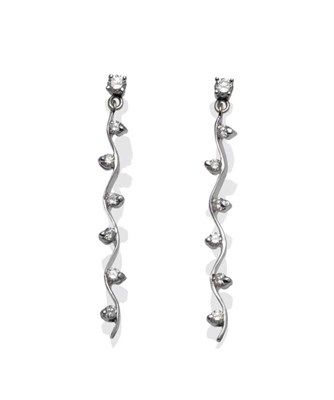 Lot 1141 - A Pair of 18 Carat White Gold Diamond Drop Earrings, a swirl form with round brilliant cut diamonds