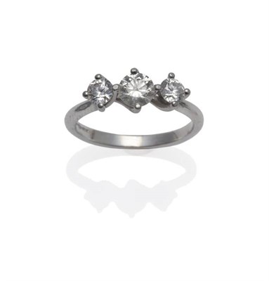 Lot 1143 - A Platinum Diamond Three Stone Ring, the three graduated round brilliant cut diamonds in claw...