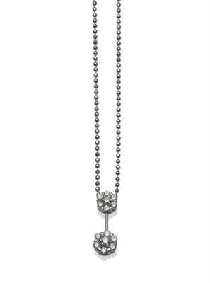 Lot 1146 - A Diamond Pendant on A Bead Chain, a cluster of round brilliant cut diamonds to a knife edge...