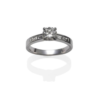 Lot 1156 - An 18 Carat White Gold Diamond Solitaire Ring, the round brilliant cut diamond in a four claw...