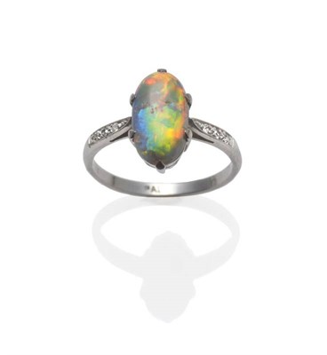 Lot 1159 - An Opal and Diamond Ring, circa 1930, the oval cabochon opal in a white claw setting, to...