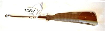 Lot 1062 - A George V Silver Folding Shoe Horn/Button Hook, Asprey & Co Ltd, London 1935, the shoe horn...