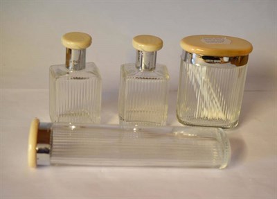 Lot 1064 - A Set of Four George V Toilet Jars, George Carsberg & Son, London 1930/31, each with reeded...