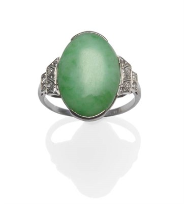 Lot 1094 - A Jade and Diamond Ring, circa 1930, the polished oval jade within stepped shoulders, with...