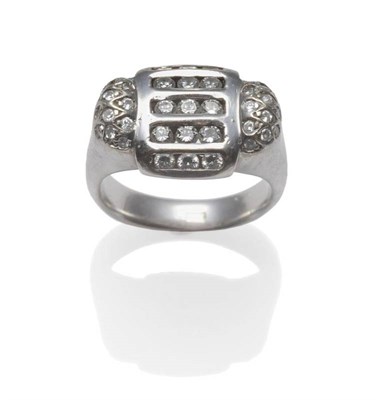 Lot 1101 - A Fancy Shaped Diamond Set Ring, with rows of channel set brilliant cut diamonds centrally, to...