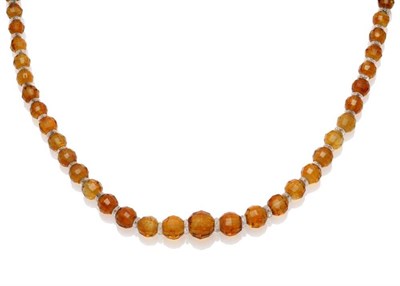 Lot 1108 - A Facetted Citrine Bead Necklace, the graduated citrines alternate with clear roundels, length 52cm