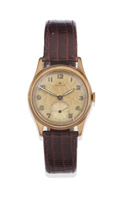 Lot 1115 - A 9ct Gold Wristwatch, signed Rolex, 1949, 15-jewel lever movement signed Rolex, silvered dial with