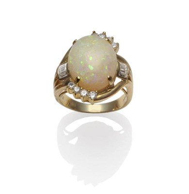 Lot 1117 - A 14 Carat Gold Opal Cocktail Ring, the cabochon opal in a yellow four claw setting, with round...