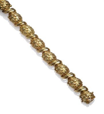 Lot 1140 - A Leaf Motif Bracelet, the textured links with curved bar connectors, length 18.5cm