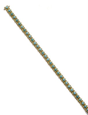 Lot 1142 - A Turquoise Set Bracelet, round cabochon turquoise in yellow floral style mounts, length 18cm