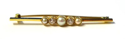 Lot 1150 - A Pearl and Diamond Bar Brooch, circa 1900, three graduated split pearls alternate with old cut...