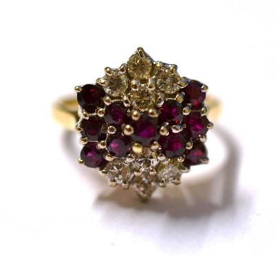 Lot 1152 - An 18 Carat Gold Ruby and Diamond Cluster Ring, the round brilliant cut diamonds and round...