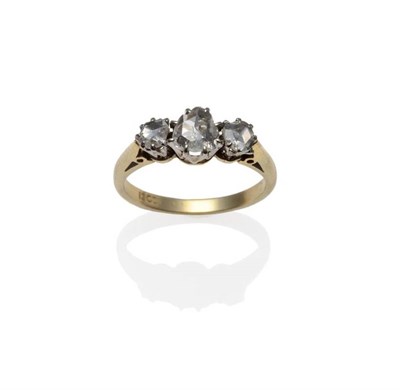 Lot 1154 - A Diamond Three Stone Ring, three graduated rose cut diamonds in white claw settings, on a...