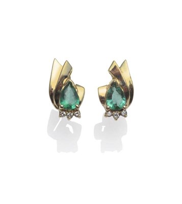 Lot 1166 - A Pair of Emerald and Diamond Earrings, the yellow asymmetric form inset with a pear cut...