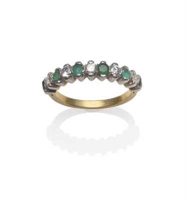 Lot 1170 - An Emerald and Diamond Half Hoop Ring, six round cut emeralds alternate with five round...