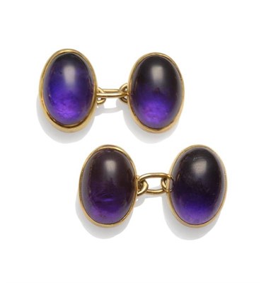 Lot 1181 - A Pair of 9 Carat Gold Amethyst Cufflinks, the oval cabochon amethysts in yellow collet...