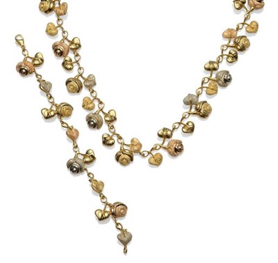 Lot 1182 - A Rose and Leaf Necklace, in yellow white and rose colours, with a mixed polished and textured...