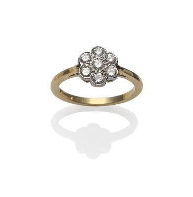 Lot 1184 - An 18 Carat Gold Diamond Cluster Ring, the seven round brilliant cut diamonds in white claw and...