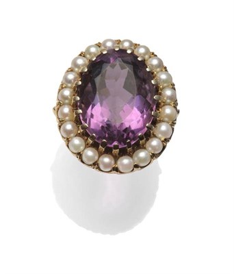 Lot 1189 - An Amethyst and Cultured Pearl Ring, the oval cut amethyst within a border of cultured pearls...