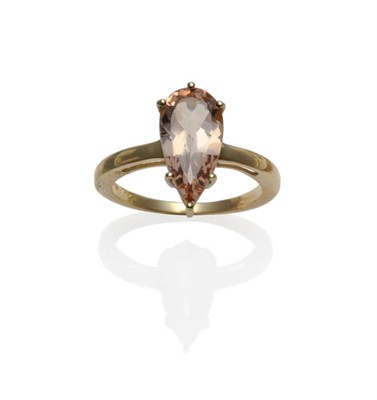 Lot 1199 - A 9 Carat Gold Morganite Solitaire Ring, the pear cut morganite of approximately 2.50 carat, in...