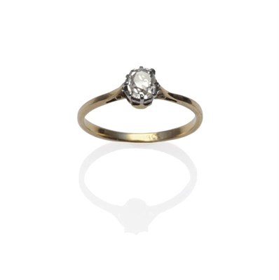 Lot 1212 - A Diamond Solitaire Ring, the old cut diamond in a white claw setting to a yellow tapered...