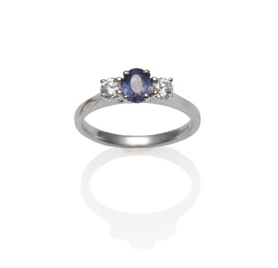 Lot 1220 - An 18 Carat White Gold Alexandrite and Diamond Three Stone Ring, the oval cut alexandrite...