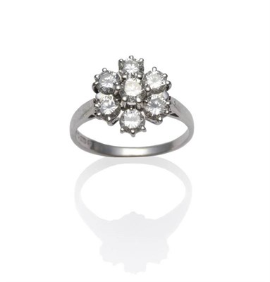 Lot 1221 - An 18 Carat White Gold Diamond Cluster Ring, the seven round brilliant cut diamonds in white...