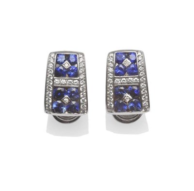 Lot 1230 - A Pair of 18 Carat White Gold Diamond and Sapphire Earrings, set with round brilliant cut...