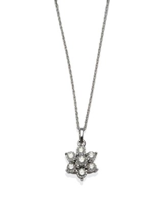 Lot 1241 - A 9 Carat White Gold Diamond Cluster Pendant, the round brilliant cut diamonds in illusion...