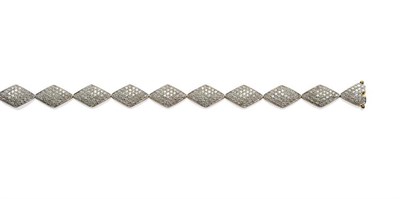 Lot 1247 - A 9 Carat Gold Diamond Set Bracelet, of diamond shaped links each pavé set with eight-cut...