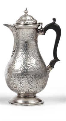 Lot 1032 - A Victorian Silver Hot Water Jug, Charles Stuart Harris, London 1884, the pear shaped body engraved