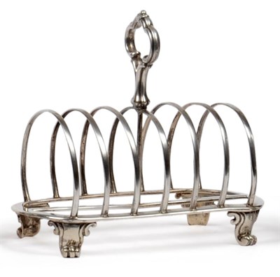 Lot 1034 - A Victorian Silver Toastrack, R & S Garrard & Co, London 1851, with a central scroll carry...